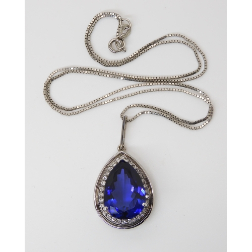 851 - A TANZANITE AND DIAMOND PENDANTset with an intense purple/blue tanzanite of approx dimensions, 18mm ... 