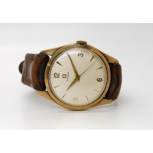 873 - A 9CT GOLD GENTS VINTAGE OMEGAwith silvered dial gold coloured chevron and arabic numerals, gold col... 