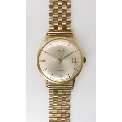 874 - A 18CT GOLD MARVIN WATCH HEADwith cream dial gold and black baton numerals and hands with date apert... 