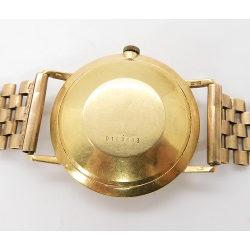 874 - A 18CT GOLD MARVIN WATCH HEADwith cream dial gold and black baton numerals and hands with date apert... 