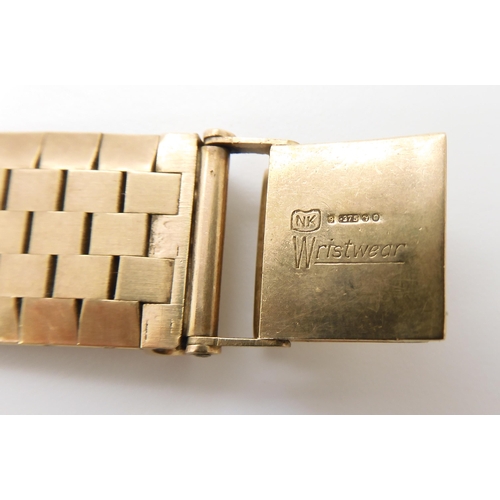 875 - AN 18CT GOLD LONGINES WATCH HEADwith cream dial, gold coloured baton numeral and hands, with a 9ct g... 