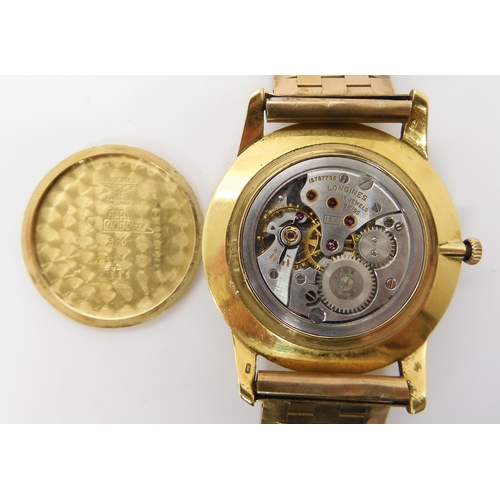 875 - AN 18CT GOLD LONGINES WATCH HEADwith cream dial, gold coloured baton numeral and hands, with a 9ct g... 