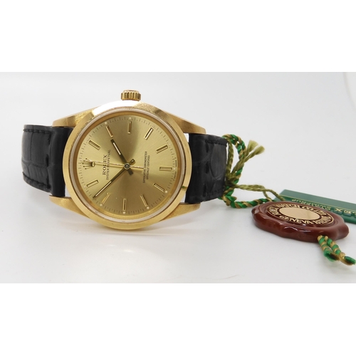 892 - AN 18CT GOLD GENTS ROLEX OYSTER PERPETUAL with gold coloured dial, baton numerals and hands. back th... 