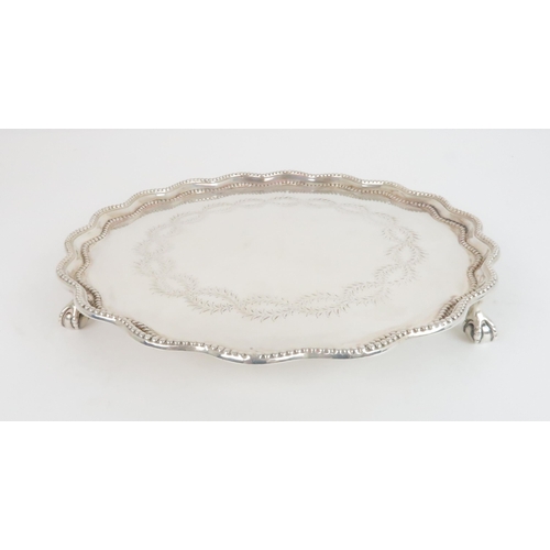 904 - A SILVER SALVER BY GARRAD & CO London 1876, of circular form with scalloped & beaded rim, th... 