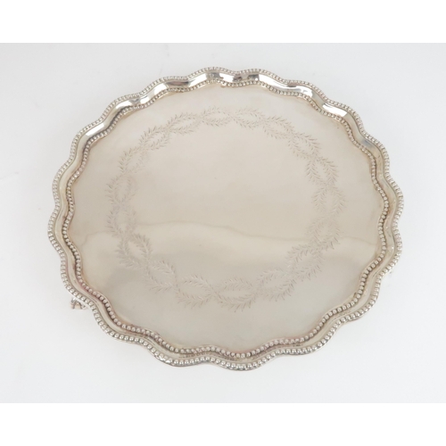 904 - A SILVER SALVER BY GARRAD & CO London 1876, of circular form with scalloped & beaded rim, th... 