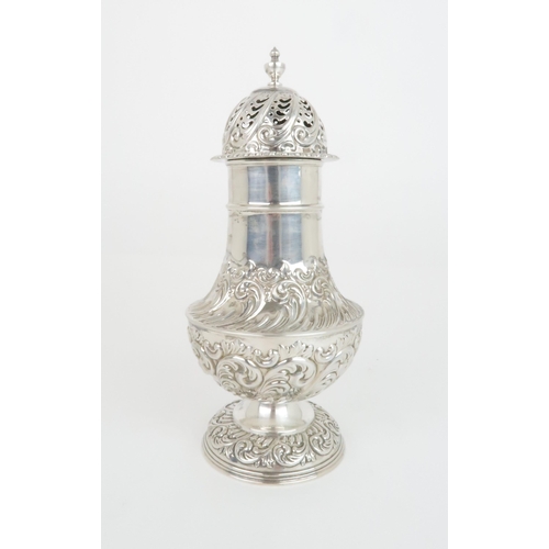 922 - A SILVER SUGAR CASTORby Fenton, Russell Co. Ltd. of baluster shape with embossed foliate decoration ... 