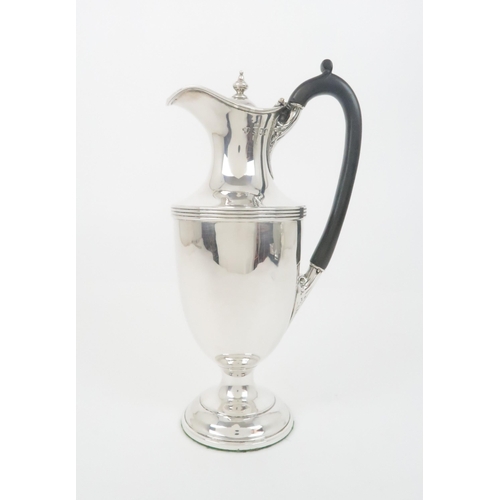 926 - A SILVER WINE EWERprobably by Charles & Richard Comyns London 1896 of baluster shape with ribbed... 