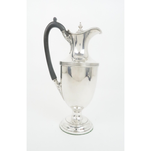 926 - A SILVER WINE EWERprobably by Charles & Richard Comyns London 1896 of baluster shape with ribbed... 