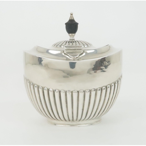 927 - A SILVER TEA CADDYunclear maker's marks London 1901 of oval form with hinged cover and half ribbed b... 