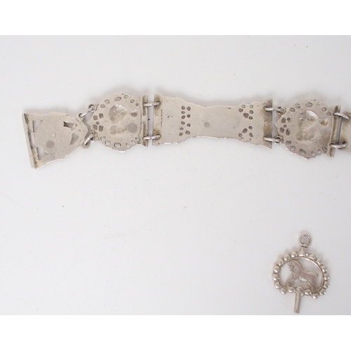 932 - A CONTINENTAL WHITE METAL BELT CHATELAINEunknown marks on the belt buckle the links with figural and... 