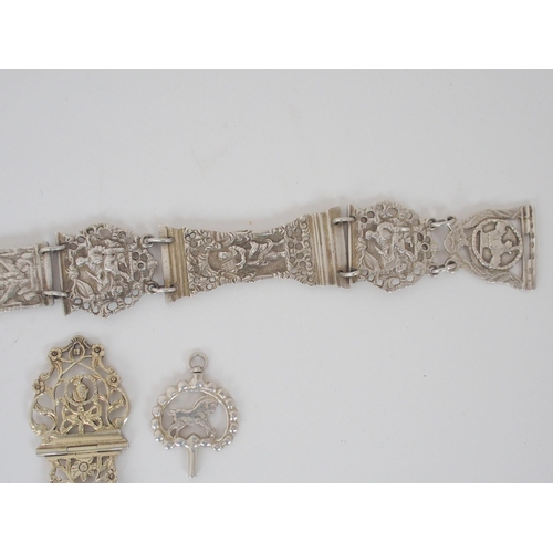 932 - A CONTINENTAL WHITE METAL BELT CHATELAINEunknown marks on the belt buckle the links with figural and... 