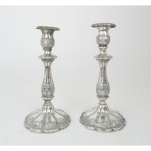 939 - A PAIR OF SILVER CANDLESTICKSLondon 1898 by Sibray, Hall & Co, 24cm high, bases weighted... 