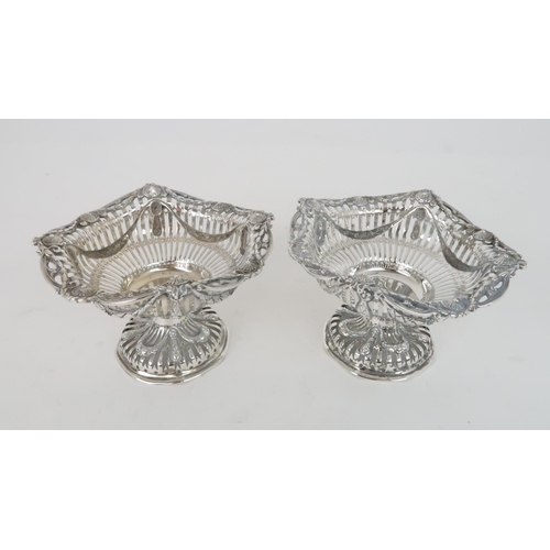 940 - A PAIR OF SILVER BON BON DISHESLondon 1905 by George Fox, with flowerhead roundels, swags and drops ... 