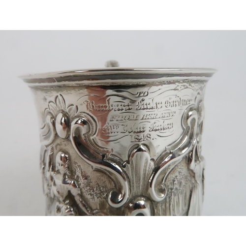 942 - A VICTORIAN SILVER CHRISTENING MUG London 1847, indistinct makers mark, decorated with figures of gi... 