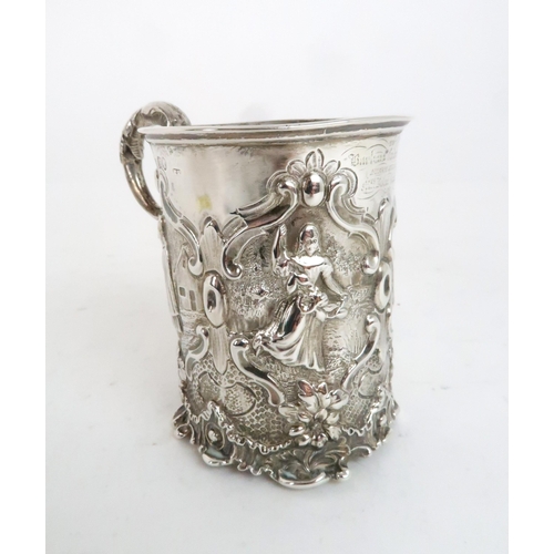 942 - A VICTORIAN SILVER CHRISTENING MUG London 1847, indistinct makers mark, decorated with figures of gi... 