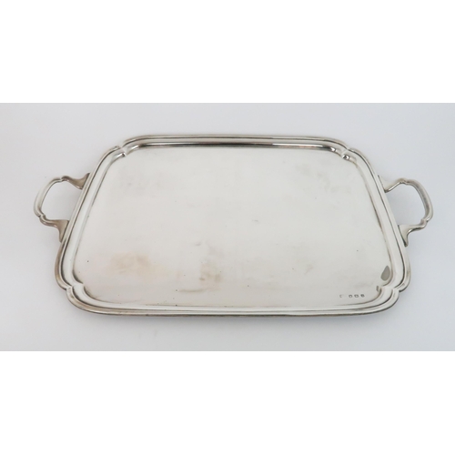 945 - A LARGE SILVER TWIN HANDLED SERVING TRAYby Viners Ltd (Emile Viner), with canted edges, approx 3170 ... 