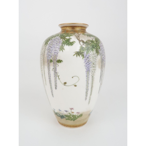 203 - A SATSUMA OVIFORM VASE by Kinkozan, painted with wisteria, hanging from a formal border and above bi... 