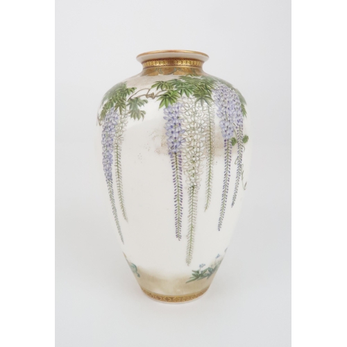 203 - A SATSUMA OVIFORM VASE by Kinkozan, painted with wisteria, hanging from a formal border and above bi... 