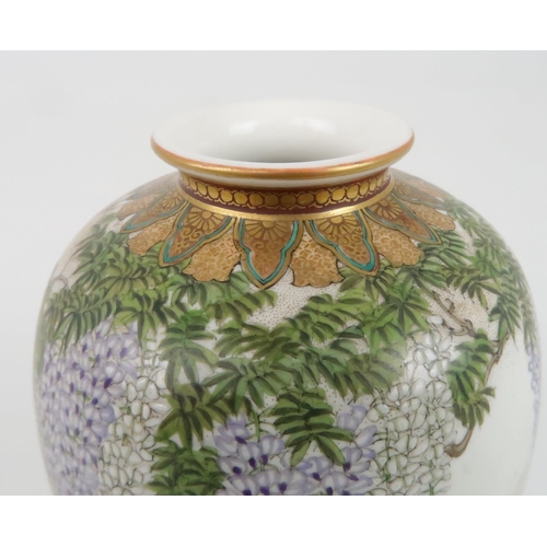 203 - A SATSUMA OVIFORM VASE by Kinkozan, painted with wisteria, hanging from a formal border and above bi... 