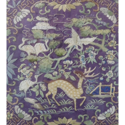 207 - THREE CHINESE SILK PANELS one embroidered with animals within a border of herons, 44 x 36cm, and two... 