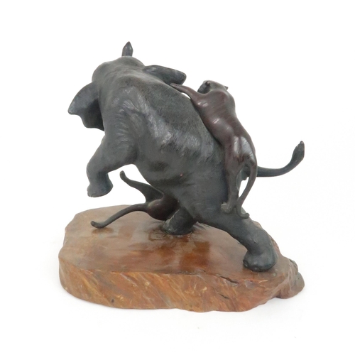 212 - A JAPANESE BRONZE MODEL OF AN ELEPHANT AND TIGERScast with two tigers attacking the rearing elephant... 