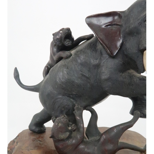 212 - A JAPANESE BRONZE MODEL OF AN ELEPHANT AND TIGERScast with two tigers attacking the rearing elephant... 