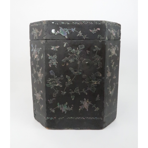 217 - A CHINESE LAC BURGAUTE TEA CHESTthe octagonal box decorated with figures in a garden and surrounded ... 