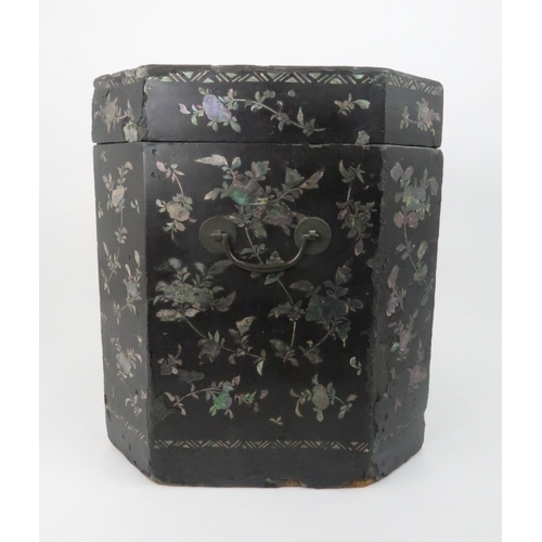 217 - A CHINESE LAC BURGAUTE TEA CHESTthe octagonal box decorated with figures in a garden and surrounded ... 