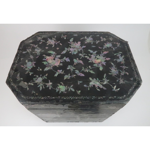 217 - A CHINESE LAC BURGAUTE TEA CHESTthe octagonal box decorated with figures in a garden and surrounded ... 