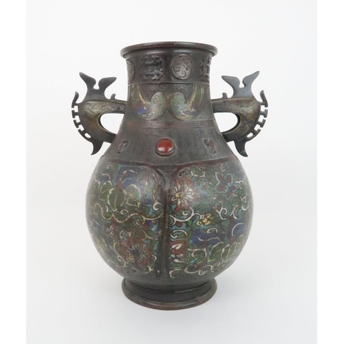 219 - A CHINESE BRONZE AND ENAMEL ARCHAIC STYLE VASEdecorated with foliate panels, beneath applied masks a... 