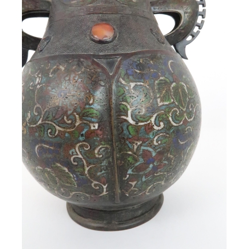 219 - A CHINESE BRONZE AND ENAMEL ARCHAIC STYLE VASEdecorated with foliate panels, beneath applied masks a... 