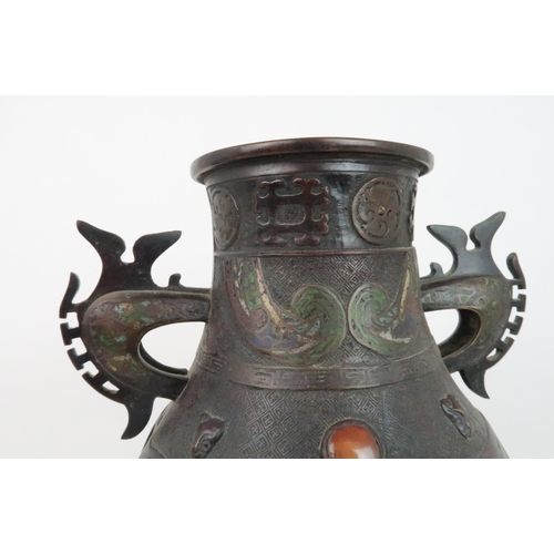 219 - A CHINESE BRONZE AND ENAMEL ARCHAIC STYLE VASEdecorated with foliate panels, beneath applied masks a... 