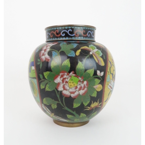 220 - A CHINESE CLOISONNE JAR AND COVERdecorated with panels of precious objects divided by flowers and fo... 