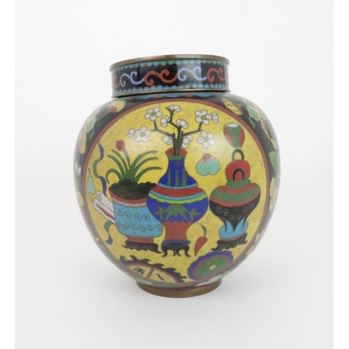 220 - A CHINESE CLOISONNE JAR AND COVERdecorated with panels of precious objects divided by flowers and fo... 