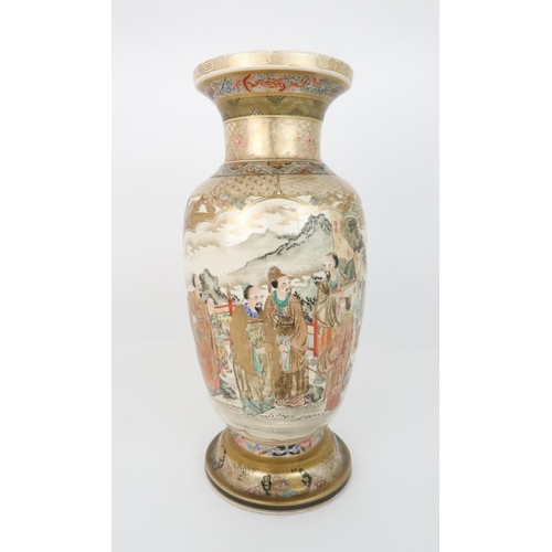 221 - A SATSUMA BALUSTER VASEby Kozan, painted with panels of officials, divided by Ho-o birds and foliage... 