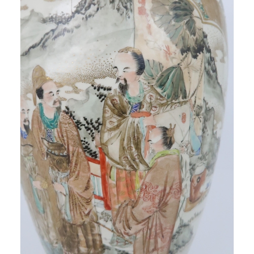 221 - A SATSUMA BALUSTER VASEby Kozan, painted with panels of officials, divided by Ho-o birds and foliage... 