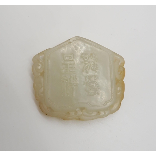 238 - A CHINESE JADE PENDANTone side carved with a phoenix the other with four character marks and pierced... 