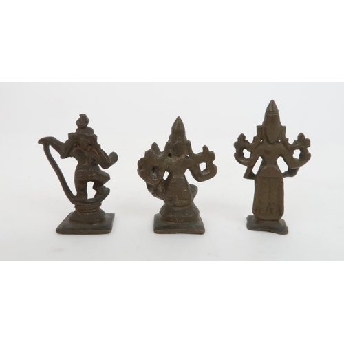 245 - THREE BURMESE BRONZE OPIUM WEIGHTSeach cast as a diety, 6cm and 7cm high (3)