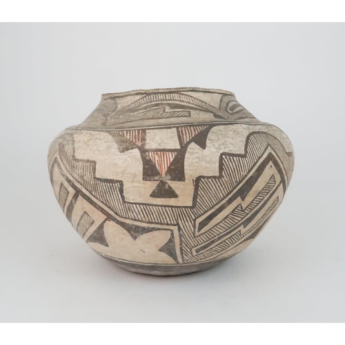 259 - A ZUNI PUEBLO POLYCHROME OLLA (WATER JAR)the inner rim painted black, the top section painted with h... 