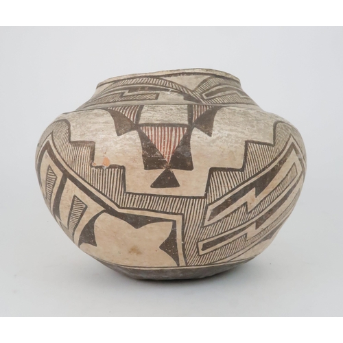 259 - A ZUNI PUEBLO POLYCHROME OLLA (WATER JAR)the inner rim painted black, the top section painted with h... 