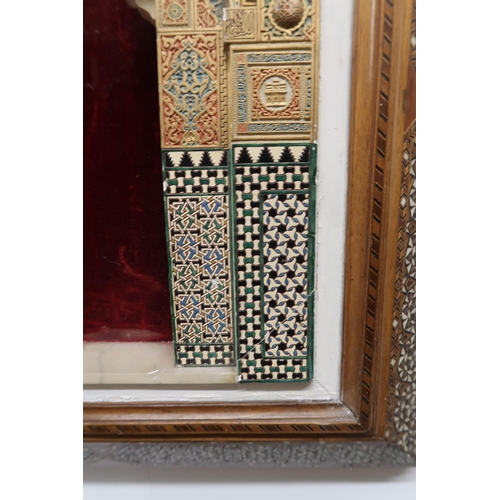 263 - A MARBLE AND PAINTED GESSO ALHAMBRA PLAQUEpolychrome and gilt, within inlaid frame, the panel, 47 x ... 