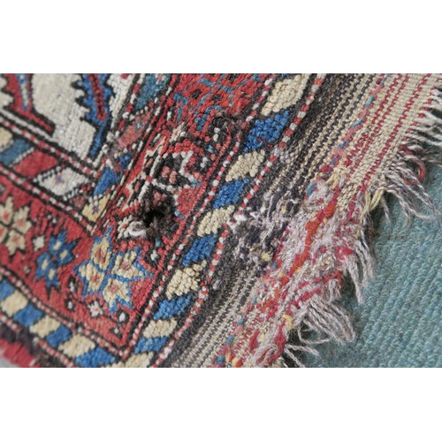 120A - A BLACK GROUND CAUCASIAN RUG, with four medallions and multicoloured borders, 246cm long x 137cm wid... 