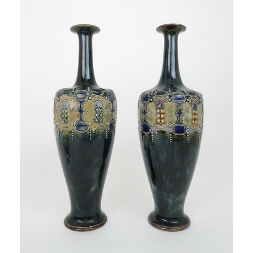 431a - A PAIR OF ROYAL DOULTON GLAZED VASESeach with raised foliate and scrolling decoration, impressed mar... 