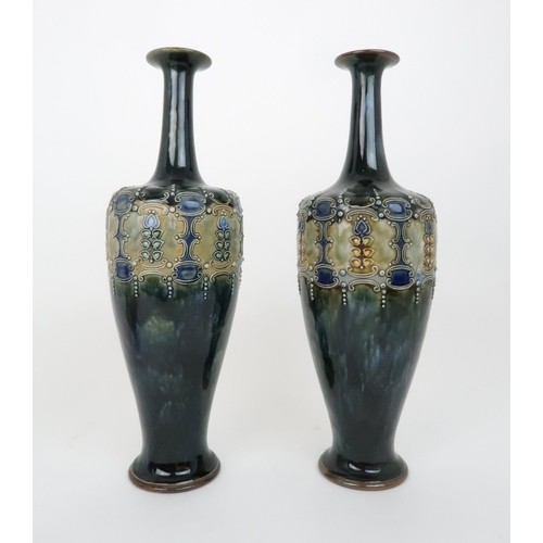 431a - A PAIR OF ROYAL DOULTON GLAZED VASESeach with raised foliate and scrolling decoration, impressed mar... 