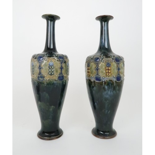 431a - A PAIR OF ROYAL DOULTON GLAZED VASESeach with raised foliate and scrolling decoration, impressed mar... 