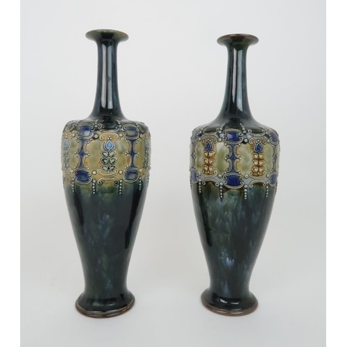 431a - A PAIR OF ROYAL DOULTON GLAZED VASESeach with raised foliate and scrolling decoration, impressed mar... 