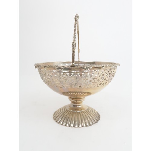 917 - A VICTORIAN SILVER SWING HANDLED BASKET by Cartwright & Woodward, Birmingham 1865, of circular f... 