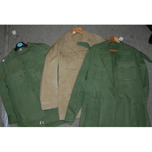 233 - Assorted military jackets and trousers...