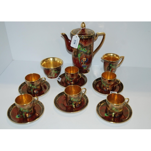 316 - A Crown Devon coffee set, pattern number 2114, decorated with a parrot...