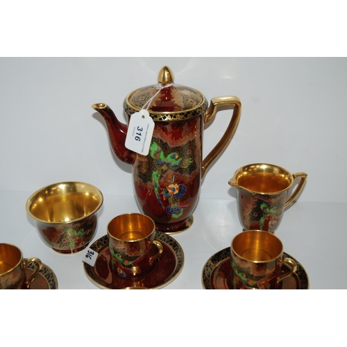 316 - A Crown Devon coffee set, pattern number 2114, decorated with a parrot...